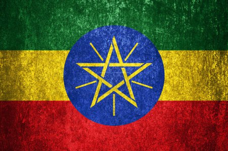 Close-up of the grunge Ethiopia flag. Dirty Ethiopia flag on a metal surface.