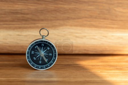 Photo for Compass on wooden background with copy space using as direction - Royalty Free Image