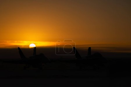 Photo for Two FA-18 Hornets sit on the tarmac before the crowds arrive at the 2022 Miramar Airshow in San Diego, California. - Royalty Free Image