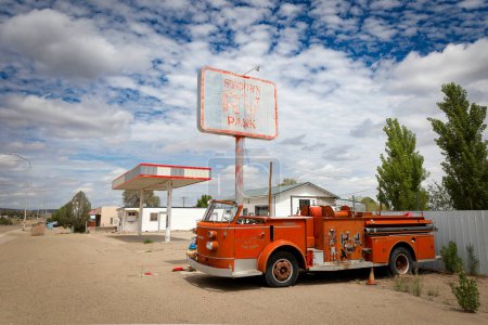 Photo for An old Fort Sumner fire engine sits next to the abandoned Sundown RV Park on Route 66 near Santa Rosa, New Mexico. - Royalty Free Image