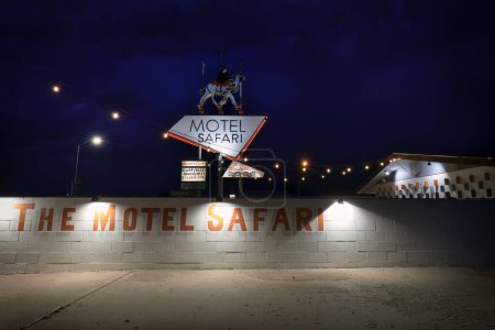 Photo for An evening storm brews over the Motel Safari on historic Route 66 in Tucumcari, New Mexico. - Royalty Free Image
