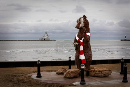 Photo for Shipbuilder the Badger, wearing a scarf, welcomes visitors to the harbor area of Manitowoc, Wisconsin. - Royalty Free Image