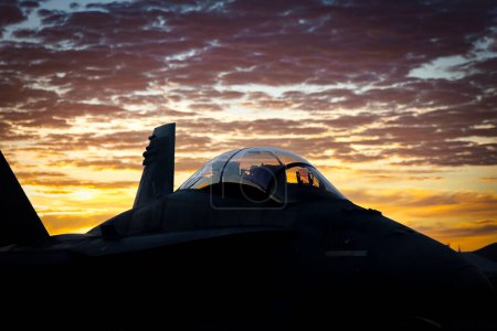 Photo for The morning sun lights the cockpit of a US Marine Corp F-18 Legacy Hornet at the 2022 Miramar Airshow in San Diego, California. - Royalty Free Image