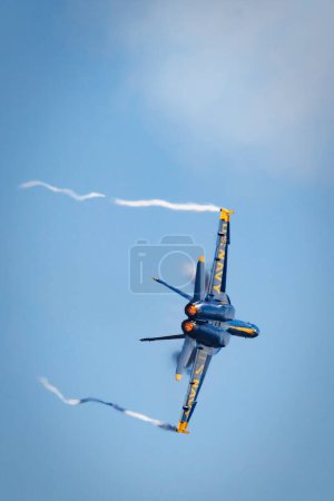 Photo for Blue Angel number three, LCDR Amanda Lee, in a tight turn leaving a vapor trail at America's Airshow 2023 in Miramar, California. - Royalty Free Image