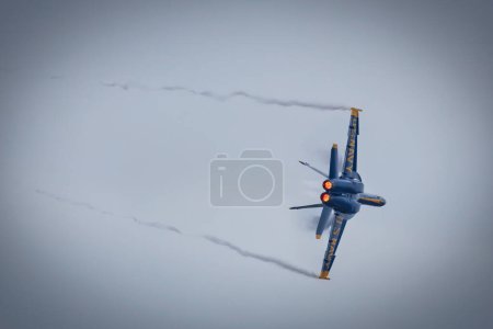 Photo for A US Navy pilot with the Blue Angels turns with afterburners on at America's Airshow 2023 in Miramar, California. - Royalty Free Image
