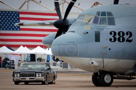 Photo for Marine Aerial Refueler Transport Squadron 352 displays a C-130 Hercules and a 1969 Lincoln Continental at America's Airshow 2023 in Miramar, California. - Royalty Free Image