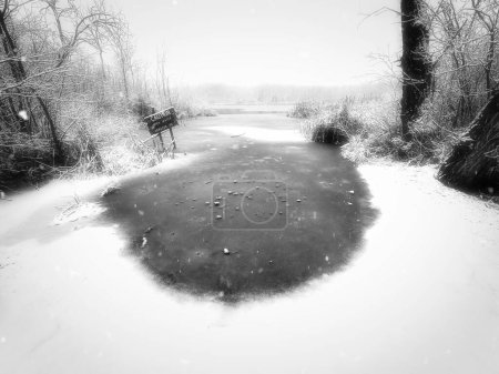 Photo for The dock area of an inland lake during a January snow storm near Manitowoc, Wisconsin. - Royalty Free Image