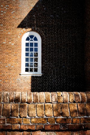Photo for A side window of the Bruton Episcopal Parish Church at Colonial Williamsburg. - Royalty Free Image