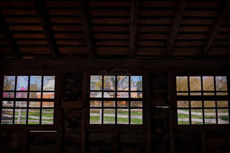 Photo for Looking out the windows of the Royal Bus Stop in to the yard at Colonial Williamsburg, Virginia. - Royalty Free Image