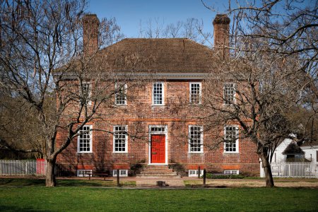 A quiet morning at a beautiful red brick home standing in Colonial Williamsburg, Virginia.