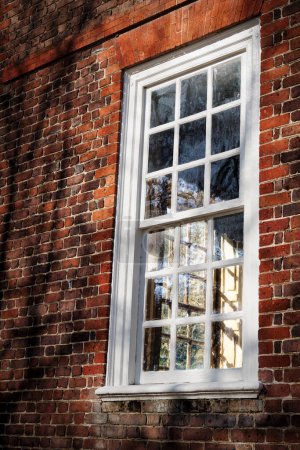 Photo for Looking at the shadows casts on the inside shutter of a home in Colonial Williamsburg, Virginia. - Royalty Free Image