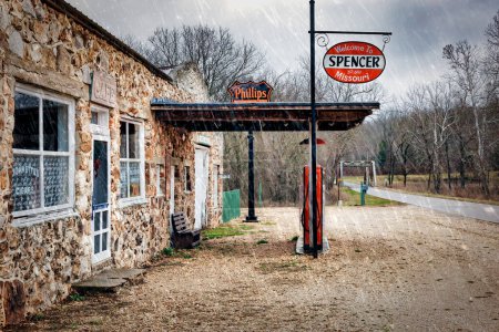 Photo for Snow flurries at Spencer Station on one of the untouched original parts of historic Route 66 near Miller, Missouri. - Royalty Free Image