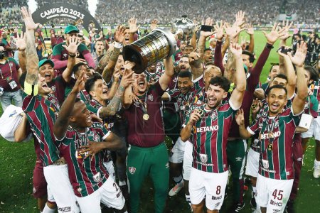 Photo for Rio de Janeiro, Brazil, November 4, 2023. Soccer players from the Fluminense team raise the trophy and celebrate winning the 2023 Copa Libertadores at the Maracan stadium. - Royalty Free Image