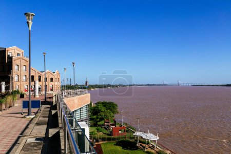 Puerto Norte neighborhood. Rosario city, Argentina. View of old loading docks in Northern Port with modern buildings, next to Parana River coast.