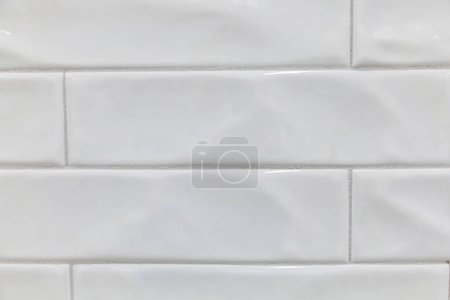 Photo for White uneven handmade wavy extra long subway tile for a backsplash, shower, bathroom wall area. - Royalty Free Image