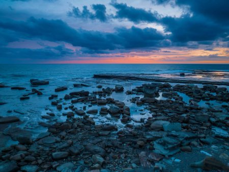 Photo for Aerial sunrise seascape with clouds at The Skillion in Terrigal, NSW, Australia. - Royalty Free Image