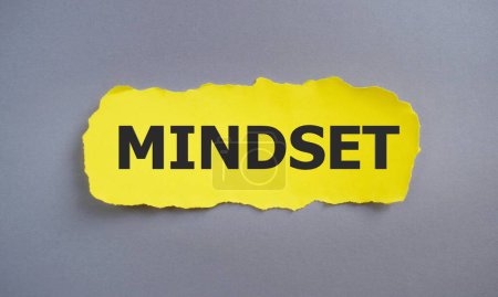 Mindset sign on yellow torn papper, Business concept,gray background Top view, Flat lay.