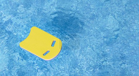 Photo for Safe pool training aid float foam board tool. Pink Swimming kickboard on blue water surface of swim pool. Mockup, Panoramic banner, copy space for text or design. Water sport, active lifestyle - Royalty Free Image