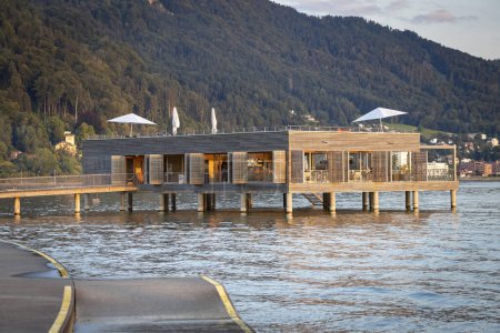 bathing house during day and night at the lake Constance for relaxing and recreation