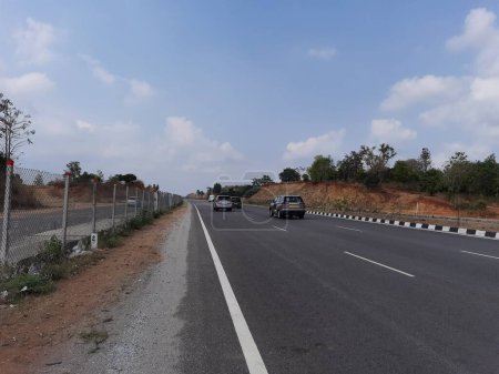 Photo for Ramanagar, Karnataka, India-Apr 25, 2023: Closeup of beautiful Ramanagara NH275 new highway road and Ramadevara Hill. - Royalty Free Image