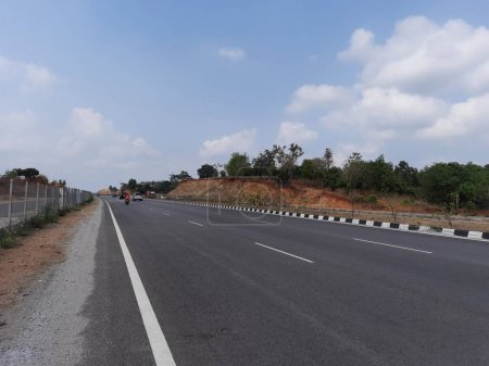 Photo for Ramanagar, Karnataka, India-Apr 25, 2023: Closeup of beautiful Ramanagara NH275 new highway road and Ramadevara Hill. - Royalty Free Image