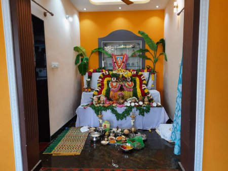 Photo for Bangalore, Karnataka, India-May 22 2023: Beautifully decorated home, god photos and doing Satyanarayana Puja during house warming ceremony. - Royalty Free Image
