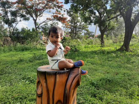 Photo for Bangalore, Karnataka, India-Jun 10, 2023: Closeup of beautiful Indian Toddler photo shoot in the park - Royalty Free Image