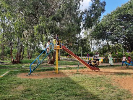 Photo for Bangalore, Karnataka, India-June 10 2023: Closeup of beautiful and real kids sport equipment in the park and playing together at Machohalli Forest Gate - Royalty Free Image