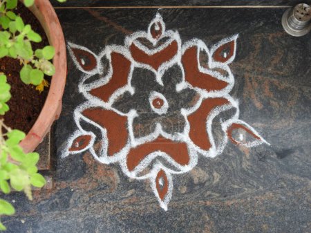 Closeup beautiful view real rangoli design in front of the house during festival as tradition.