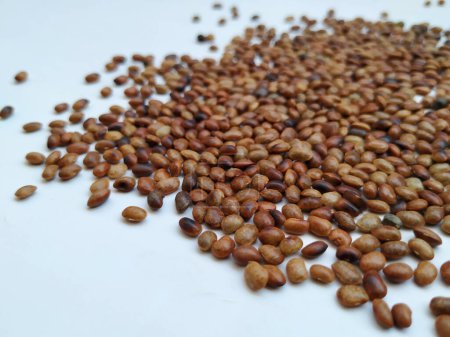 Pile and Texture of Hurali Kalu or Horse Gram isolated on white background. Closeup of horse gram seeds which is used in cooking.