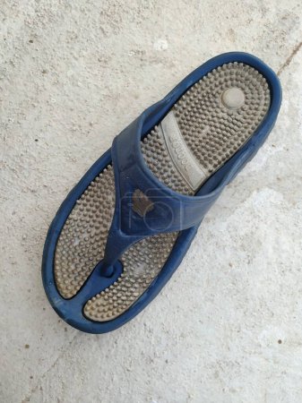 Bangalore, Karnataka, India-Mar 21 2020: Blue and White Color diabetic or acupressure slipper.