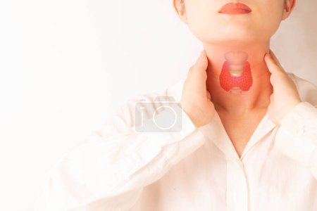 Photo for Female checking thyroid gland by herself. Close up of woman touching neck with thyroid gland organ. Thyroid disorder includes goiter, hyperthyroid, hypothyroid, tumor or cancer. World Thyroid Day. - Royalty Free Image