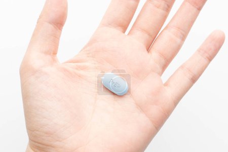 Photo for PrEP (Pre-Exposure Prophylaxis) tablet on human hands used to prevent HIV infection. - Royalty Free Image