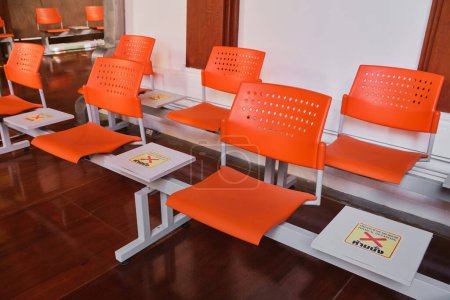 Photo for Orange long benches, physically distancing - Royalty Free Image
