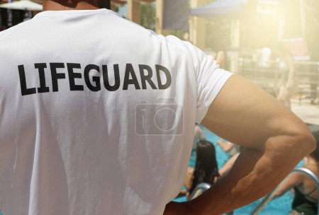 Lifeguard on Duty at swimming poll. 