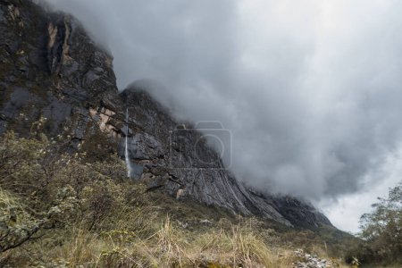 Photo for Landscape mountain shrouded in clouds, featuring a stunning waterfall. A picturesque addition to your stock image collection - Royalty Free Image