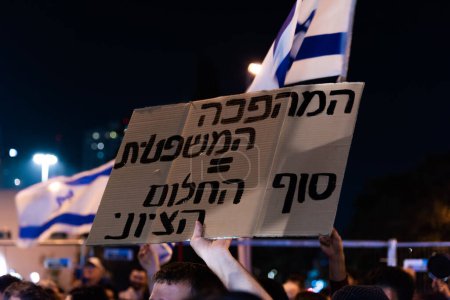 Photo for TEL AVIV, ISRAEL - January 21, 2023: Israelis protest in Tel Aviv against plans by prime minister Benjamin Netanyahu new government to trample the legal system and the supreme court. High quality - Royalty Free Image