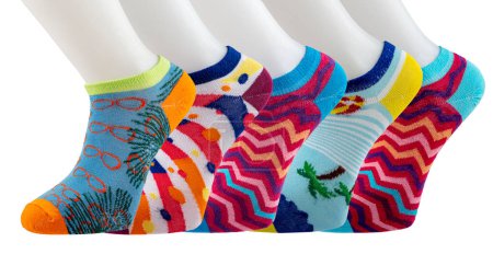 Photo for Colorful socks on a white background. A good gift for a loved one. Fun colorful socks on a white background with copy space. Colorful socks from a plastic lifeless foot mannequin. - Royalty Free Image