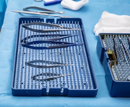 Photo for Ophthalmic Surgical Instruments. Ophthalmic surgery instrument set in container. Ophthalmic surgical instruments and surgical supplies surgeons use for ophthalmic procedures. - Royalty Free Image