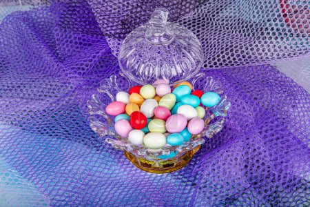 Photo for Almond candies.Colorful candies in glass bowl served with tea; almond sweets. Sugar Feast, (Feast of Ramadan) Ramadan concepts. - Royalty Free Image