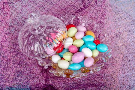 Photo for Almond candies.Colorful candies in glass bowl served with tea; almond sweets. Sugar Feast, (Feast of Ramadan) Ramadan concepts. - Royalty Free Image