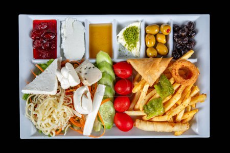 Photo for Traditional Turkish breakfast plate on black background, top view. Healthy Turkish breakfast in the bright morning; copy space for text. Rich and delicious Turkish breakfast on the table. - Royalty Free Image