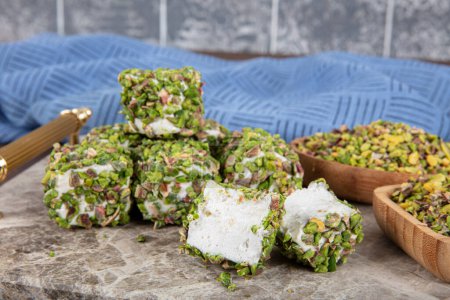 Photo for Delicious Turkish Delight with pistachios. Assortment of Turkish delight with pistachio. Mixed Turkish Delight. local name Antep fistikli lokum. - Royalty Free Image