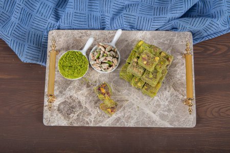 Photo for Delicious Turkish Delight with pistachios. Assortment of Turkish delight with pistachio. Mixed Turkish Delight. local name Antep fistikli lokum. - Royalty Free Image