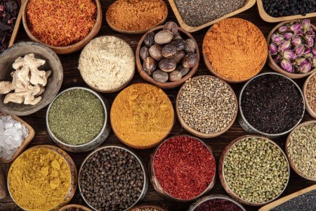 Photo for Colorful background with various herbs and spices for cooking in bowls. Seamless texture with spices and herbs. - Royalty Free Image
