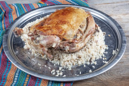 Photo for Stuffed lamb ribs. Lamb ribs on rice. Stuffed Ribs isolated on black background. Turkish name; "Kaburga dolmasi". - Royalty Free Image