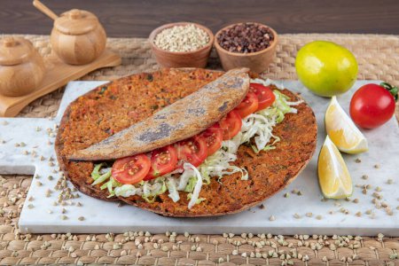 Lahmacun from buckwheat flour. Turkish dishes: lahmacun, turkish pizzas, lemon, parsley. Healthy eating, dieting, slimming and weigh loss concept.
