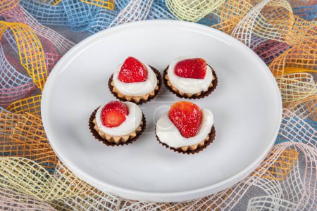 Tasty strawberry cream cake. Pastry. Sweet dessert tartolet. Delicious cake basket with strawberries and cream.