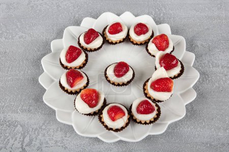 Tasty strawberry cream cake. Pastry. Sweet dessert tartolet. Delicious cake basket with strawberries and cream.