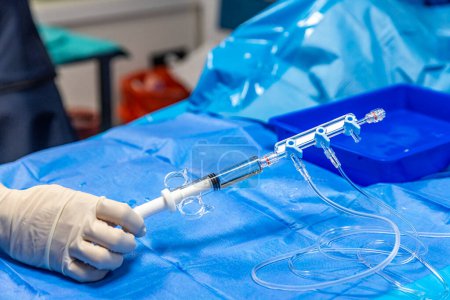 The procedure of inserting a double lumen catheter into a patient with cardiovascular occlusion in the hospital. Doctor insert double lumen catheter. insert guide wire. 